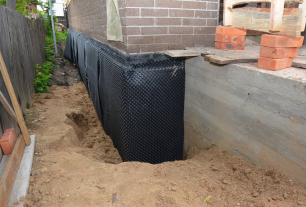 SJ Waterproofing Pros technician performing targeted Exterior Waterproofing assessment in Belmont, NC
